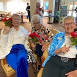 Mountain View Gardens Gracious Retirement Living Hawthorn Senior Independent Living in Sierra Vista, Arizona residents holding bouquets of flowers