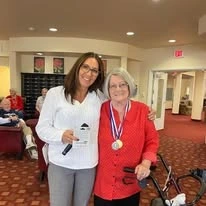 Estrella Estates Gracious Retirement Living Hawthorn Senior Independent Living in Goodyear, Arizona resident with a staff member