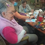 Allisonville Meadows Assisted Living offering assisted living, memory care, and respite care in Fishers, IN, residents doing arts and crafts