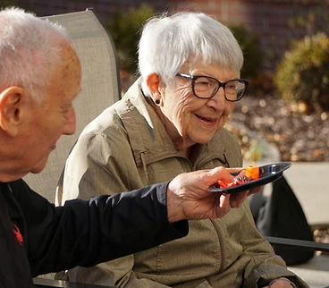 couple at Sage Independence sharing food