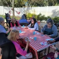 Sonata Coconut Creek seniors having a picnic outside