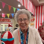 Linwood Estates Gracious Retirement Living Hawthorn Senior Independent Living in Lawrenceville, Georgia resident at a carnival themed party