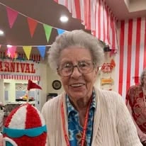 Linwood Estates Gracious Retirement Living Hawthorn Senior Independent Living in Lawrenceville, Georgia resident at a carnival themed party