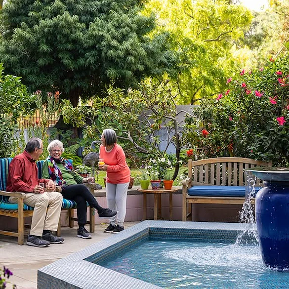 Piedmont Gardens Senior Living in Oakland, CA, residents enjoying the outdoor space and socializing