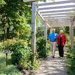 The Mansion at Rosemont Senior Living in Rosemont, PA, residents on a relaxing walk