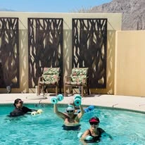 The Palms At La Quinta Gracious Retirement Living Hawthorn Senior Independent Living in La Quinta, California residents playing in the pool