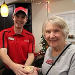 Williams Place Gracious Retirement Living Hawthorn Senior Independent Living in Davidson, North Carolina resident being handed ice cream by a chef