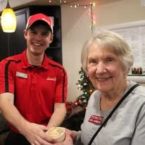 Williams Place Gracious Retirement Living Hawthorn Senior Independent Living in Davidson, North Carolina resident being handed ice cream by a chef
