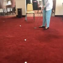 Sterling Heights Gracious Retirement Living Hawthorn Senior Independent Living in Bethlehem, Pennsylvania resident mini golfing indoors