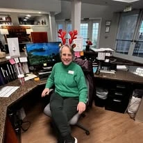 Avamere at Hillsboro Senior Living in Oregon staff member dressed up for Christmas