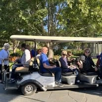 Liberty Heights Gracious Retirement Living Hawthorn Senior Independent Living in Rockwall, Texas residents on a golf cart
