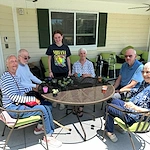 Faith Cottages Memory Care Basehor, KS, residents enjoy time outdoors and an engaging activity