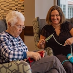 Fieldstone Memory Care of Puyallup resident enjoying an activity with companionship
