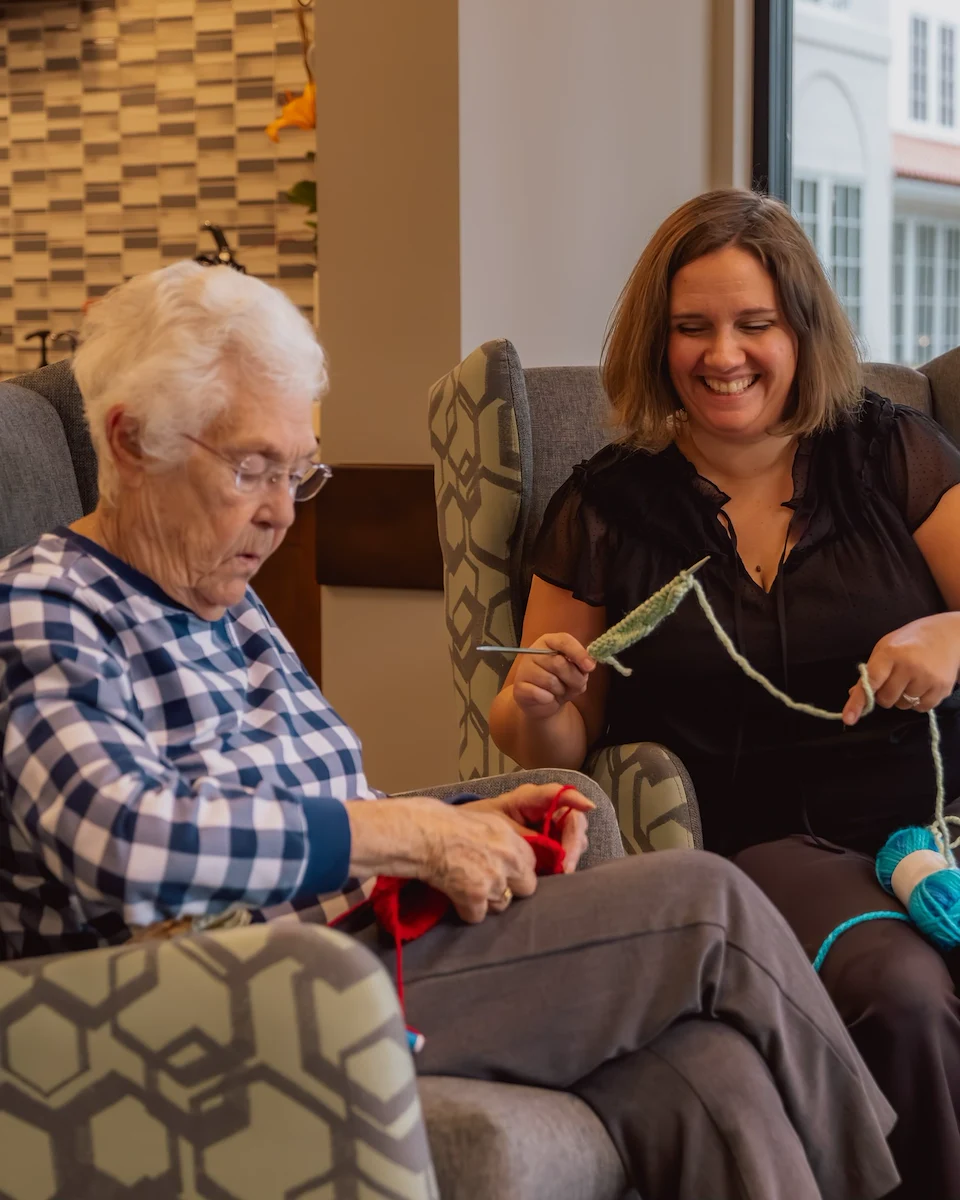 Fieldstone Memory Care of Puyallup resident enjoying an activity with companionship