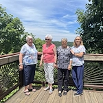 Wesley Manor Assisted Living Community offering assisted living and continuing care retirement community (CCRC) services in Louisville, KY, residents smiling during an off-site trip