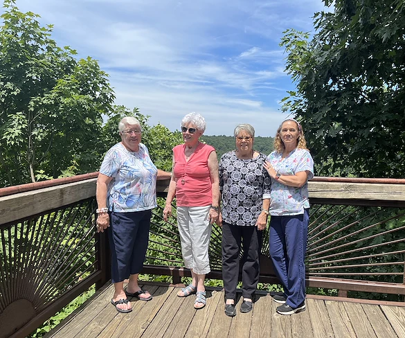 Wesley Manor Assisted Living Community offering assisted living and continuing care retirement community (CCRC) services in Louisville, KY, residents smiling during an off-site trip