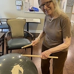 The Seasons@Alexandria (Assisted Living) resident enjoying making music