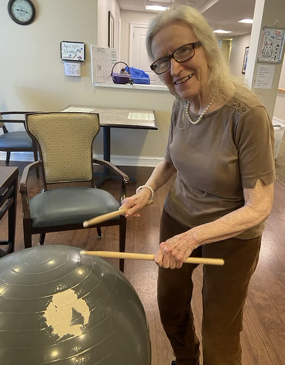 The Seasons@Alexandria (Assisted Living) resident enjoying making music