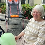 Playing pop a shot with balloons