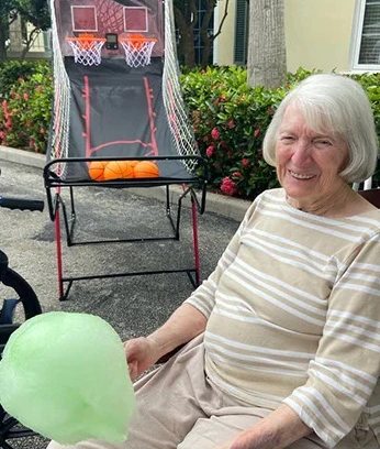 Playing pop a shot with balloons