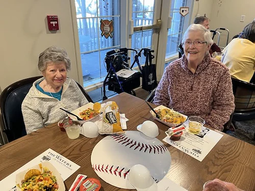 Waters of Eden Prairie residents enjoy a nacho bar to celebrate the start of baseball season