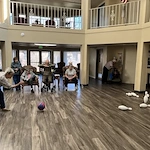 Whealdon Estates by Barclay House senior living community offering independent living in Baton Rouge, LA, residents stay active by participating in community bowling game