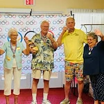 The Palms At La Quinta Gracious Retirement Living Hawthorn Senior Independent Living in La Quinta, California residents holding medals