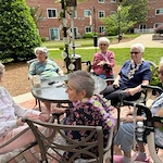 Bartlett Reserve independent living in Durham, NC, residents enjoying beautiful weather outdoors