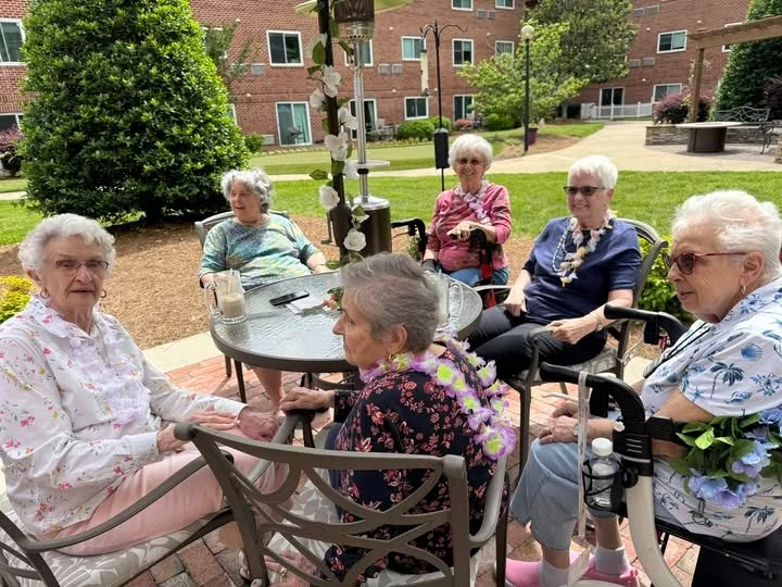 Bartlett Reserve independent living in Durham, NC, residents enjoying beautiful weather outdoors