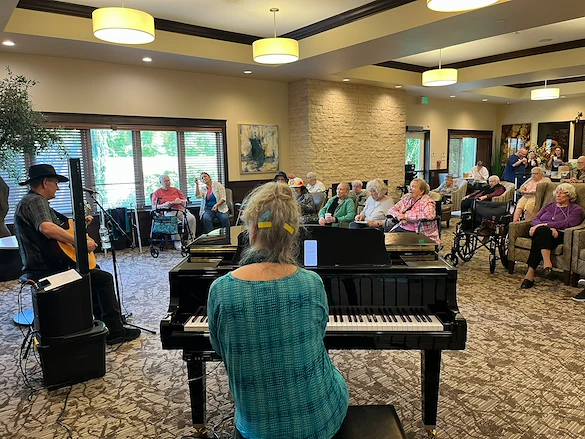 The Village at Keizer Ridge Assisted Living and Memory Care residents enjoy listening to music