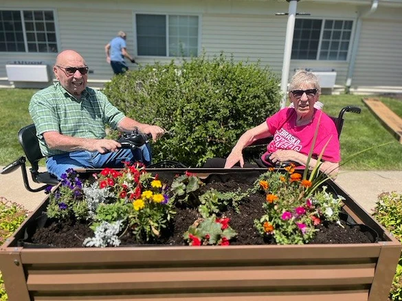 Pathfinder Senior Living in Fremont, NE, residents enjoying the nice weather outdoors