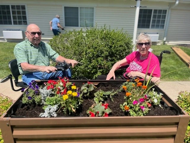 Pathfinder Senior Living in Fremont, NE, residents enjoying the nice weather outdoors