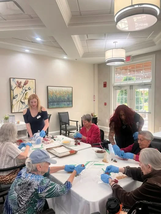 Bartlett Reserve independent living in Durham, NC, residents making treats together during a community activity