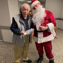 Ascension Living Resurrection Village Senior Living in Chicago, Illinois resident with Santa Claus