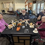 Avamere at Englewood Heights senior living community offering assisted living, memory care, and respite care in Yakima, WA, residents at a community Thanksgiving party