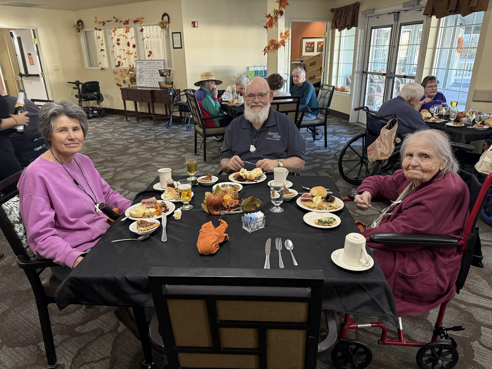 Avamere at Englewood Heights senior living community offering assisted living, memory care, and respite care in Yakima, WA, residents at a community Thanksgiving party
