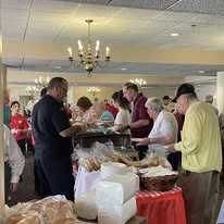 Ascension Casa Scalabrini Senior Living, independent senior living community in Northlake, IL, residents at a dinner party