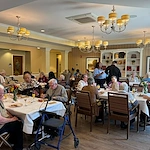Pomeroy Living Northville residents dining together and enjoying each other's company