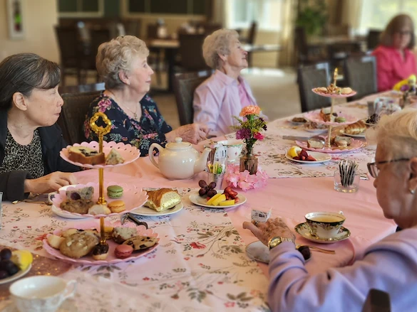Chateau Bothell Landing in Bothell, WA, residents enjoy a tea party