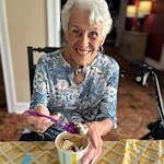Highgrove at Tates Creek Lexington, KY, happy resident enjoying a sweet treat