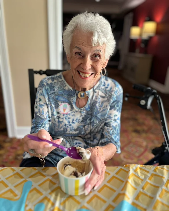 Highgrove at Tates Creek Lexington, KY, happy resident enjoying a sweet treat