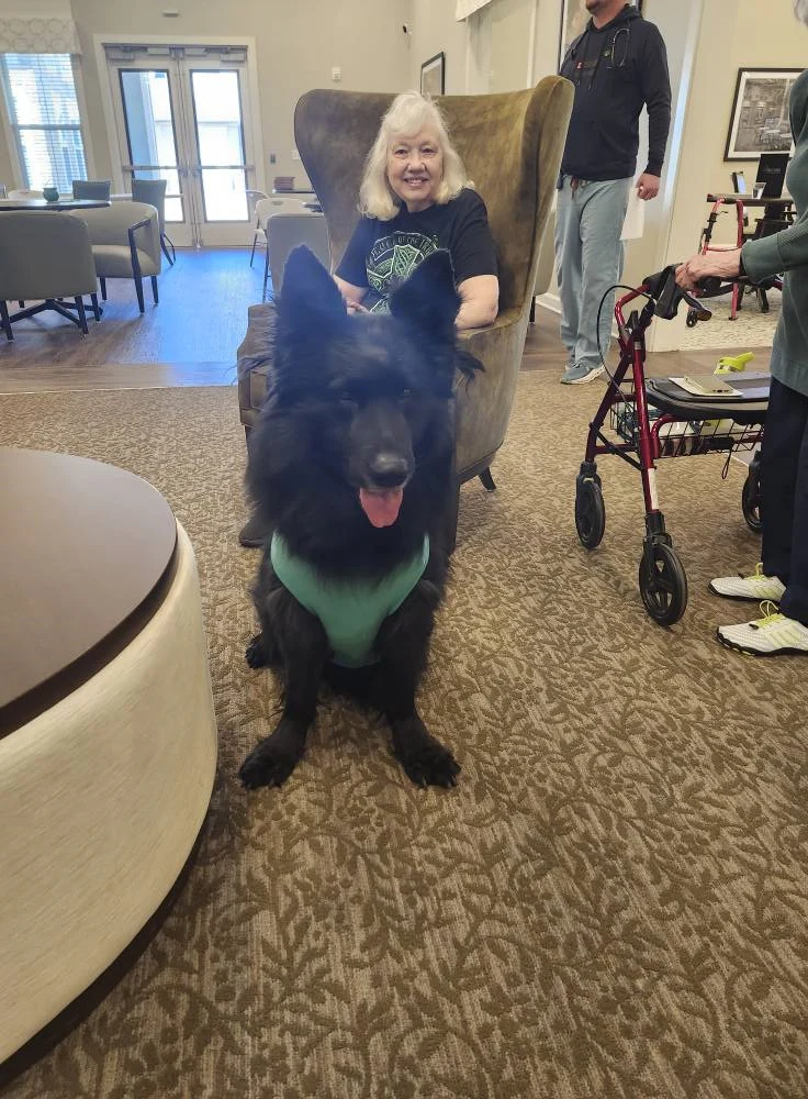 A Pinnacle Grove Senior Living resident and a special guest enjoying the St. Patrick's Day celebration