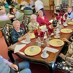 Salmon Creek Gracious Retirement Living Hawthorn Senior Independent Living in Boise, Idaho resident eating at a dining table