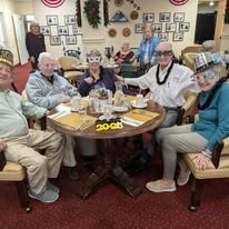 Williams Place Gracious Retirement Living Hawthorn Senior Independent Living in Davidson, North Carolina residents at a New Years party