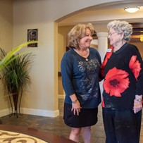 Franklin Park at Sonterra residents chatting and smiling