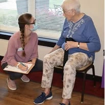 The Oaks Gracious Retirement Living Hawthorn Senior Independent Living in Georgetown, Texas resident being helped by a nurse