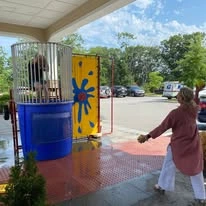 Ashton Gardens Gracious Retirement Living Hawthorn Senior Living Community in Portland, Maine resident in dunk tank