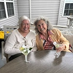 Bennett Place in New Albany, IN, smiling residents enjoying each other's company