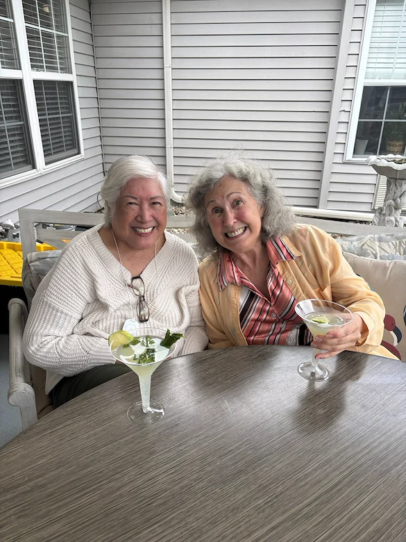 Bennett Place in New Albany, IN, smiling residents enjoying each other's company