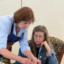 Suzanne Elise Assisted Senior Living in Seaside, Oregon resident being helped by a staff member